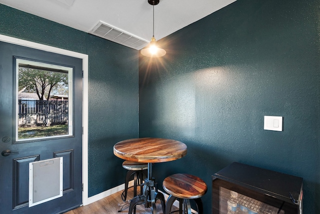 dining space with hardwood / wood-style flooring