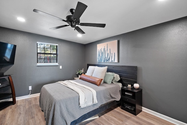 bedroom featuring ceiling fan and light hardwood / wood-style floors