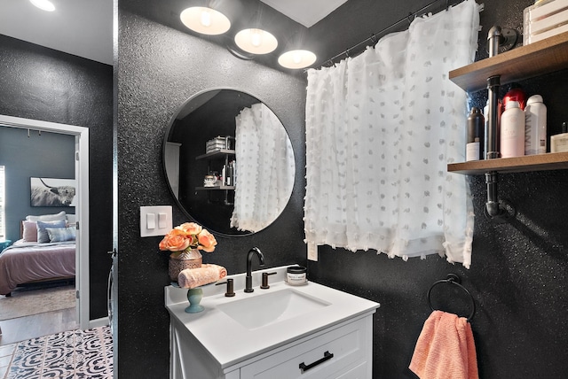 bathroom with tile patterned flooring and vanity