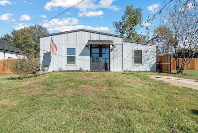 view of outbuilding featuring a yard