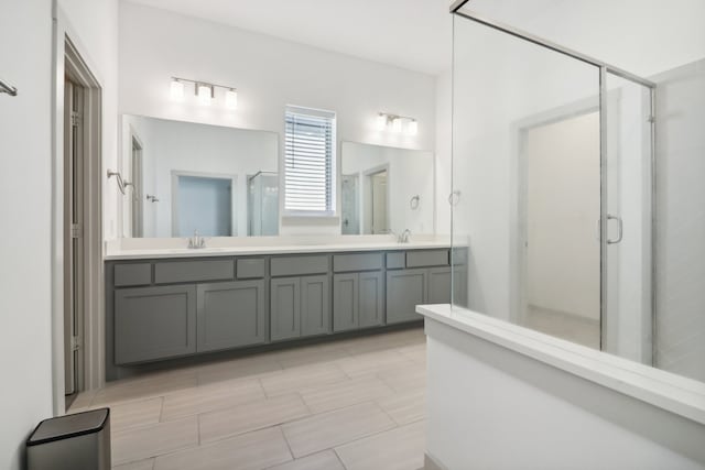 bathroom with vanity and an enclosed shower