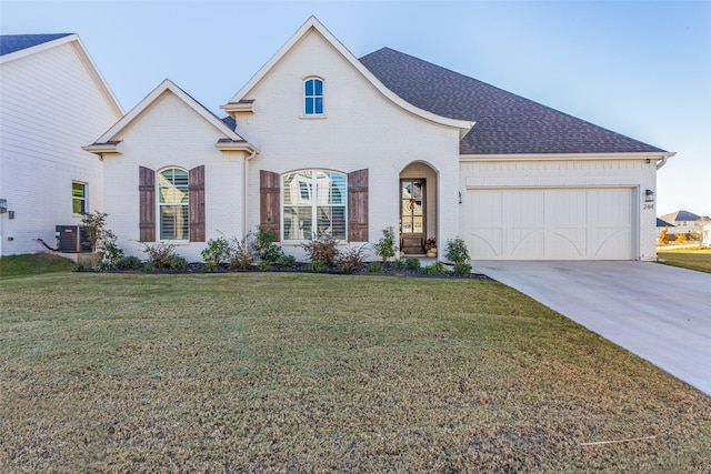 view of front of home featuring a garage and a front yard