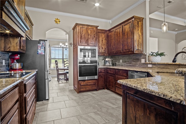 kitchen with ornamental molding, sink, and tasteful backsplash