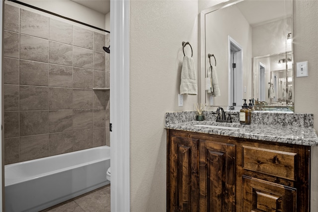 full bathroom with vanity, toilet, and tiled shower / bath