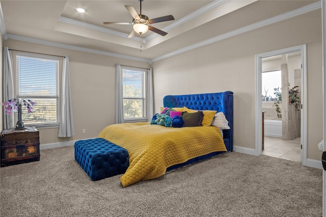 bedroom featuring ensuite bathroom, ceiling fan, light colored carpet, and ornamental molding