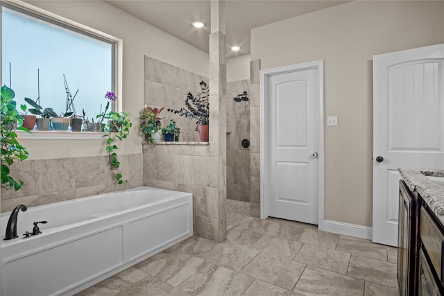 bathroom featuring wine cooler, vanity, and separate shower and tub