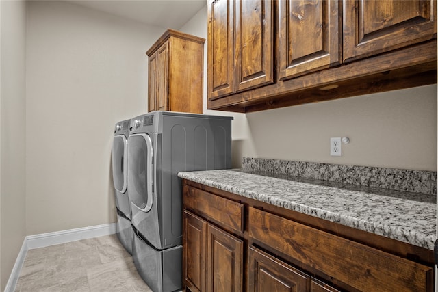 washroom with cabinets and separate washer and dryer