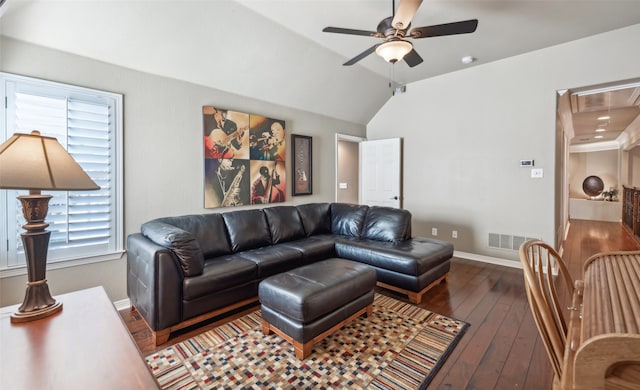 living room with ceiling fan, lofted ceiling, and dark wood-type flooring