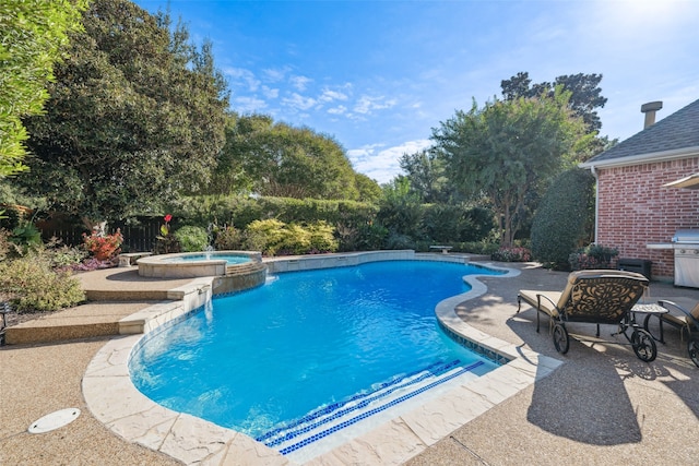 view of swimming pool featuring an in ground hot tub and a patio