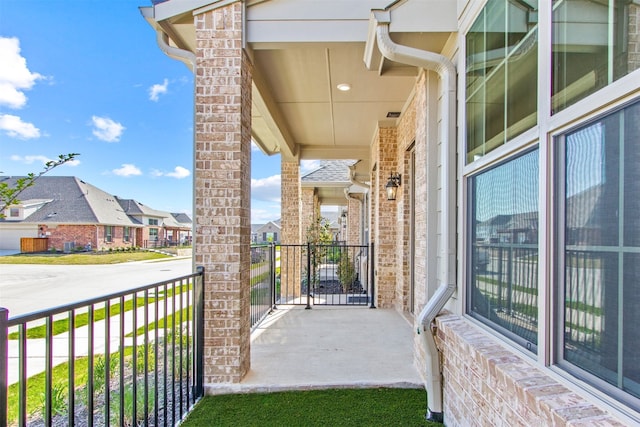 balcony featuring a residential view
