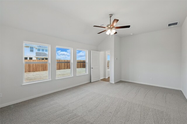 spare room featuring a ceiling fan, baseboards, visible vents, and carpet floors