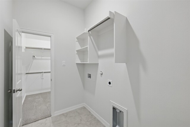 laundry room featuring hookup for a washing machine, baseboards, gas dryer hookup, laundry area, and electric dryer hookup