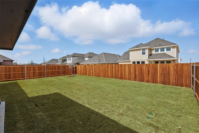 view of yard with a fenced backyard