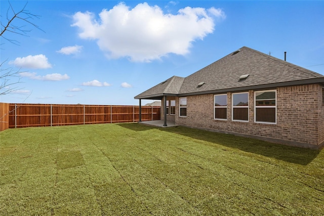 view of yard with a patio and a fenced backyard