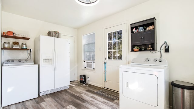 laundry room featuring dark wood-type flooring and washer and clothes dryer