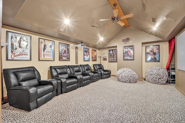 home theater room with ceiling fan, carpet, and lofted ceiling