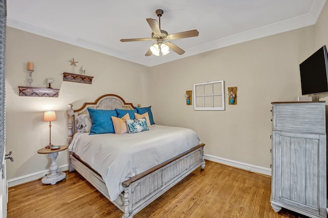 bedroom with ceiling fan, crown molding, and light hardwood / wood-style flooring