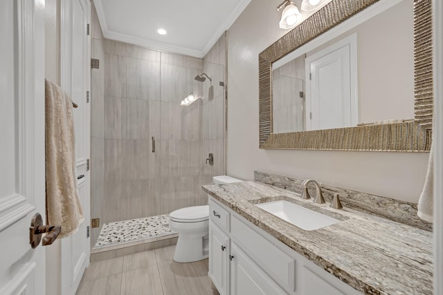 bathroom with toilet, vanity, tile patterned flooring, crown molding, and a shower with door