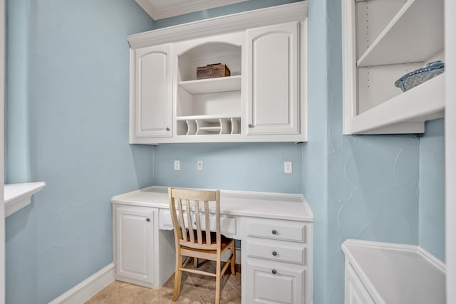 office with built in desk and crown molding