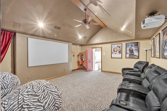 home theater room featuring vaulted ceiling, ceiling fan, and carpet