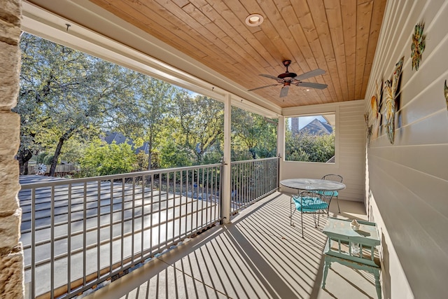 wooden terrace featuring ceiling fan