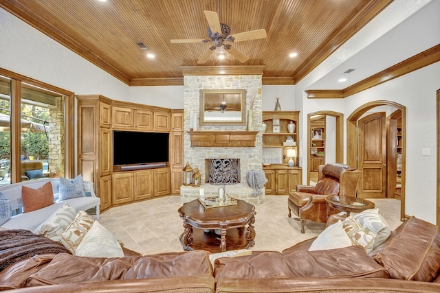 living room featuring ceiling fan, wooden ceiling, a stone fireplace, and vaulted ceiling