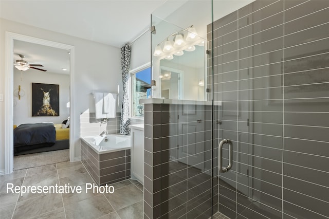 bathroom featuring tile patterned flooring, ceiling fan, vanity, and plus walk in shower