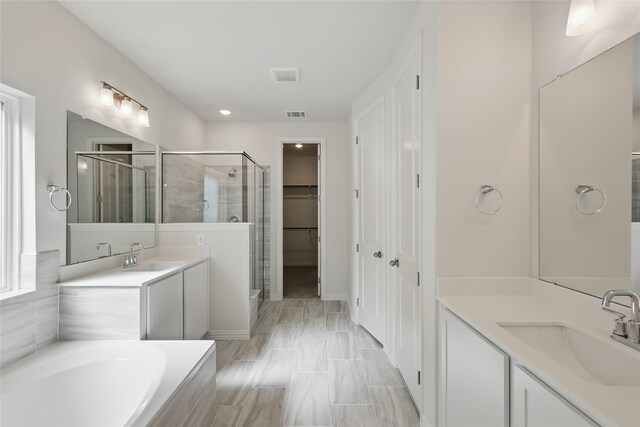 5036 Water Lily Ln, Fort Worth, TX 76036 - full bath with a sink, visible vents, two vanities, and a shower stall