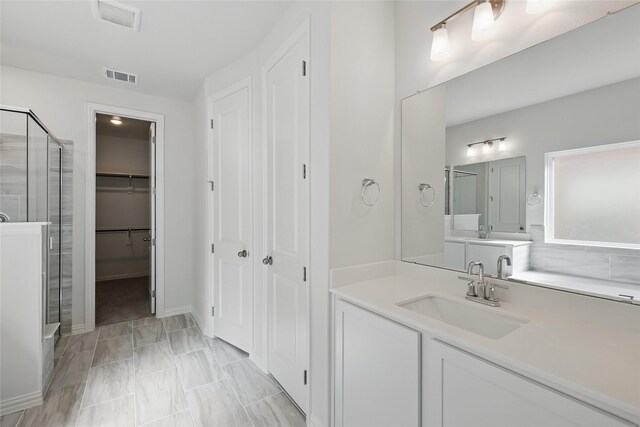 5036 Water Lily Ln, Fort Worth, TX 76036 - full bath with visible vents, a shower stall, vanity, and a walk in closet