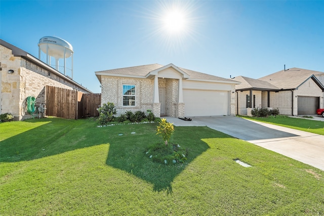 view of front of home with a front lawn and a garage