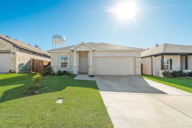 view of front of house with a garage and a front yard