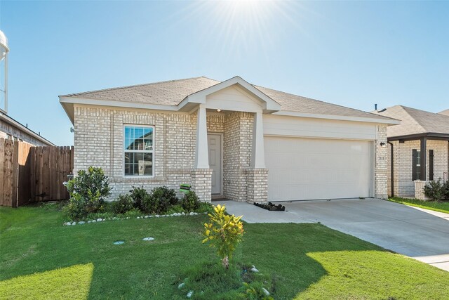 ranch-style house featuring a garage and a front yard