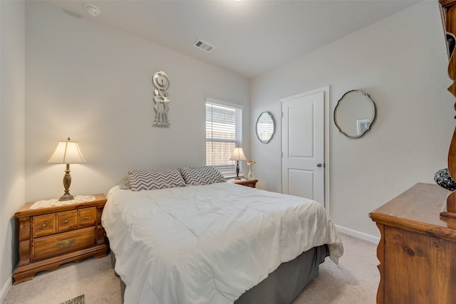 bedroom featuring light carpet