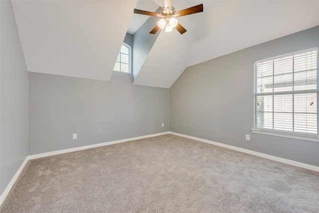 bonus room featuring ceiling fan, light colored carpet, and lofted ceiling