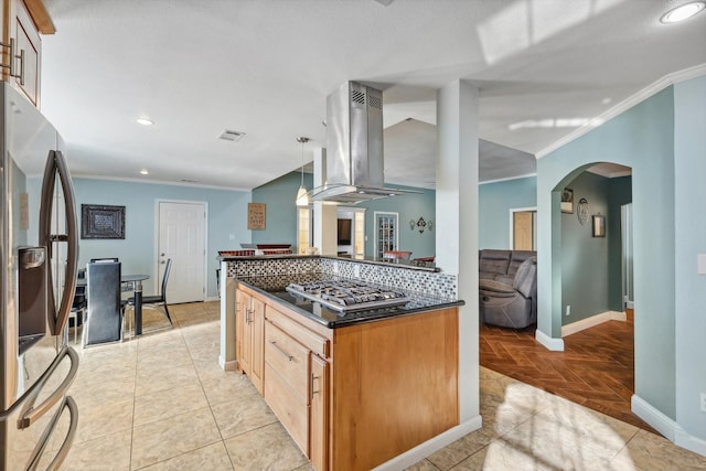 kitchen featuring island range hood, backsplash, hanging light fixtures, stainless steel appliances, and crown molding