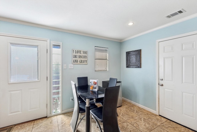 dining room featuring ornamental molding