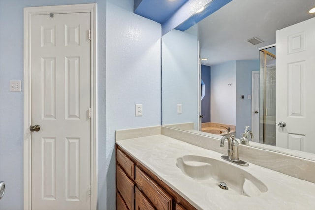 bathroom with vanity and plus walk in shower