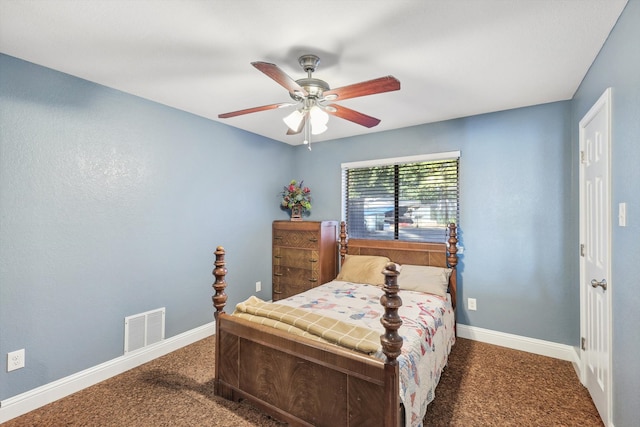 bedroom featuring ceiling fan and dark carpet