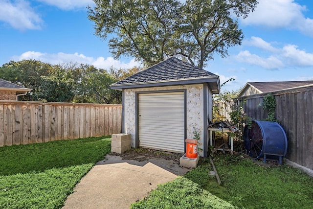 view of outbuilding with a lawn