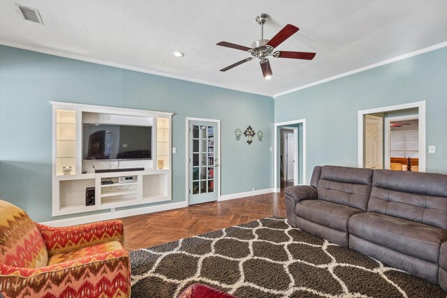 dining room with crown molding, light parquet flooring, and a tray ceiling