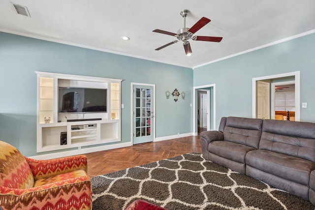 living room featuring dark parquet flooring, ceiling fan, and crown molding