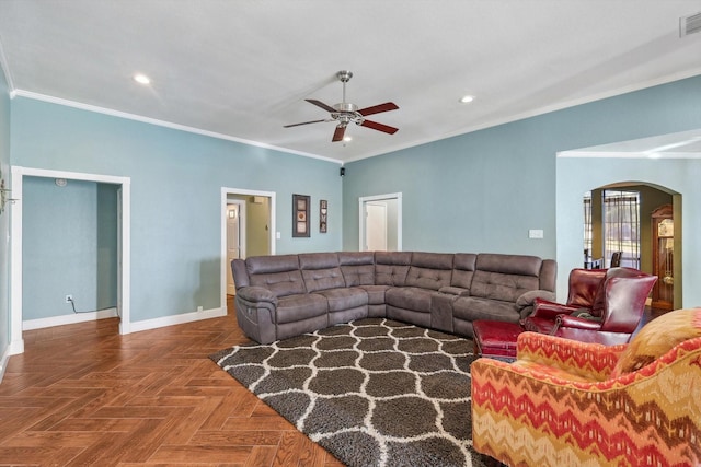 living room with ornamental molding, parquet flooring, and ceiling fan