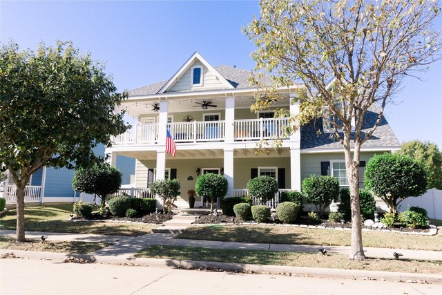 view of front facade featuring ceiling fan, a balcony, and a porch