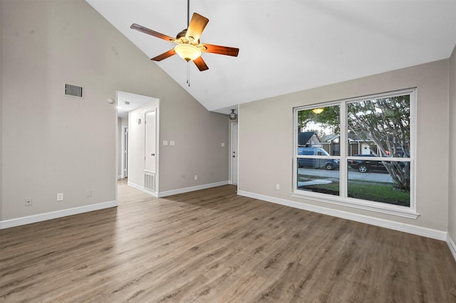 unfurnished living room featuring hardwood / wood-style floors, ceiling fan, and high vaulted ceiling