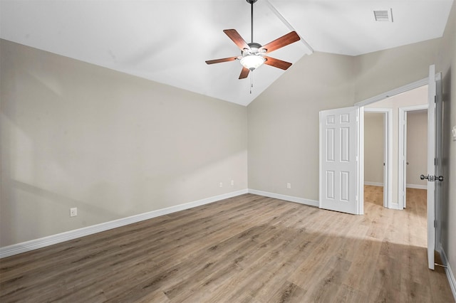 unfurnished bedroom featuring light hardwood / wood-style flooring, ceiling fan, and lofted ceiling