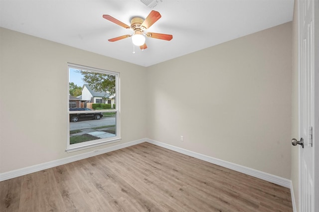 unfurnished room with ceiling fan and light hardwood / wood-style flooring