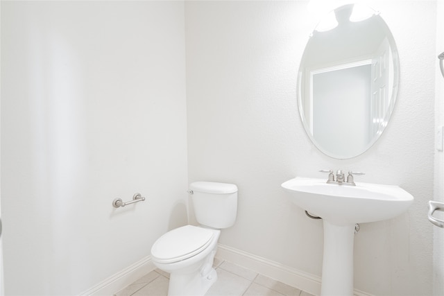 bathroom featuring tile patterned floors and toilet