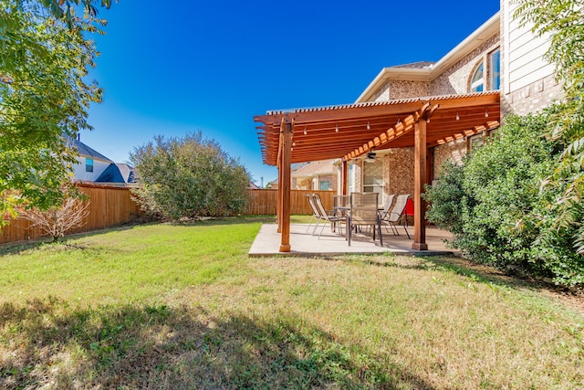 view of yard with a pergola and a patio