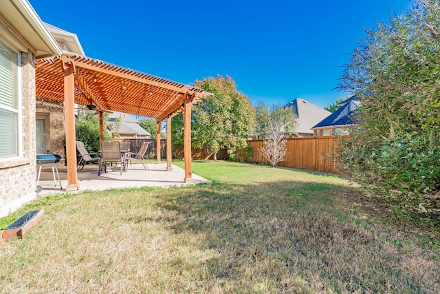 view of yard with a pergola and a patio