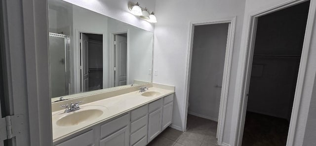 bathroom with walk in shower, tile patterned floors, and vanity